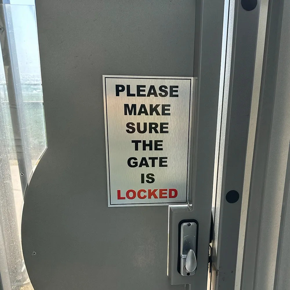 Metal door sign, please make sure the gate is locked