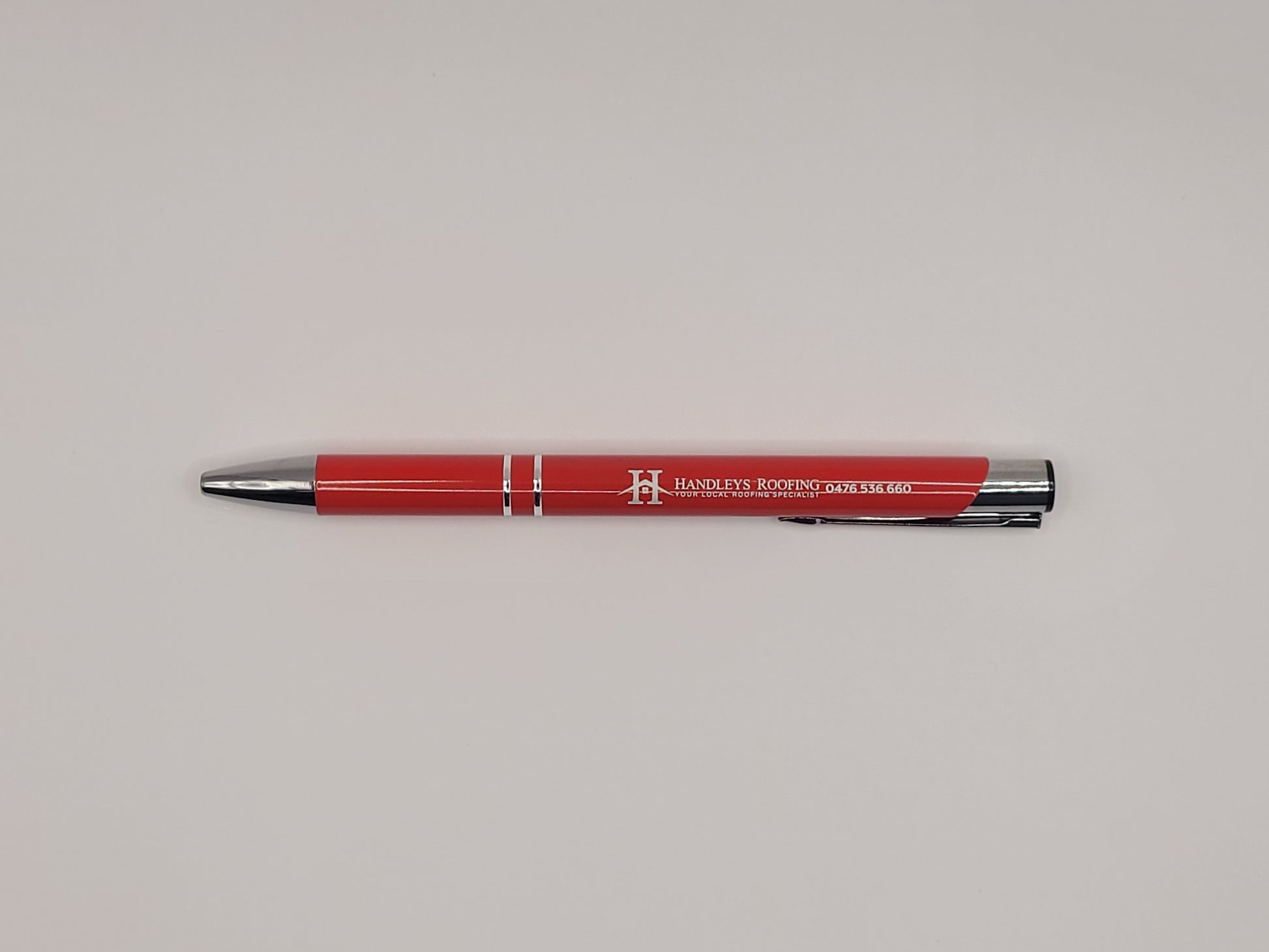 Client give-away, pen branded with logo, red